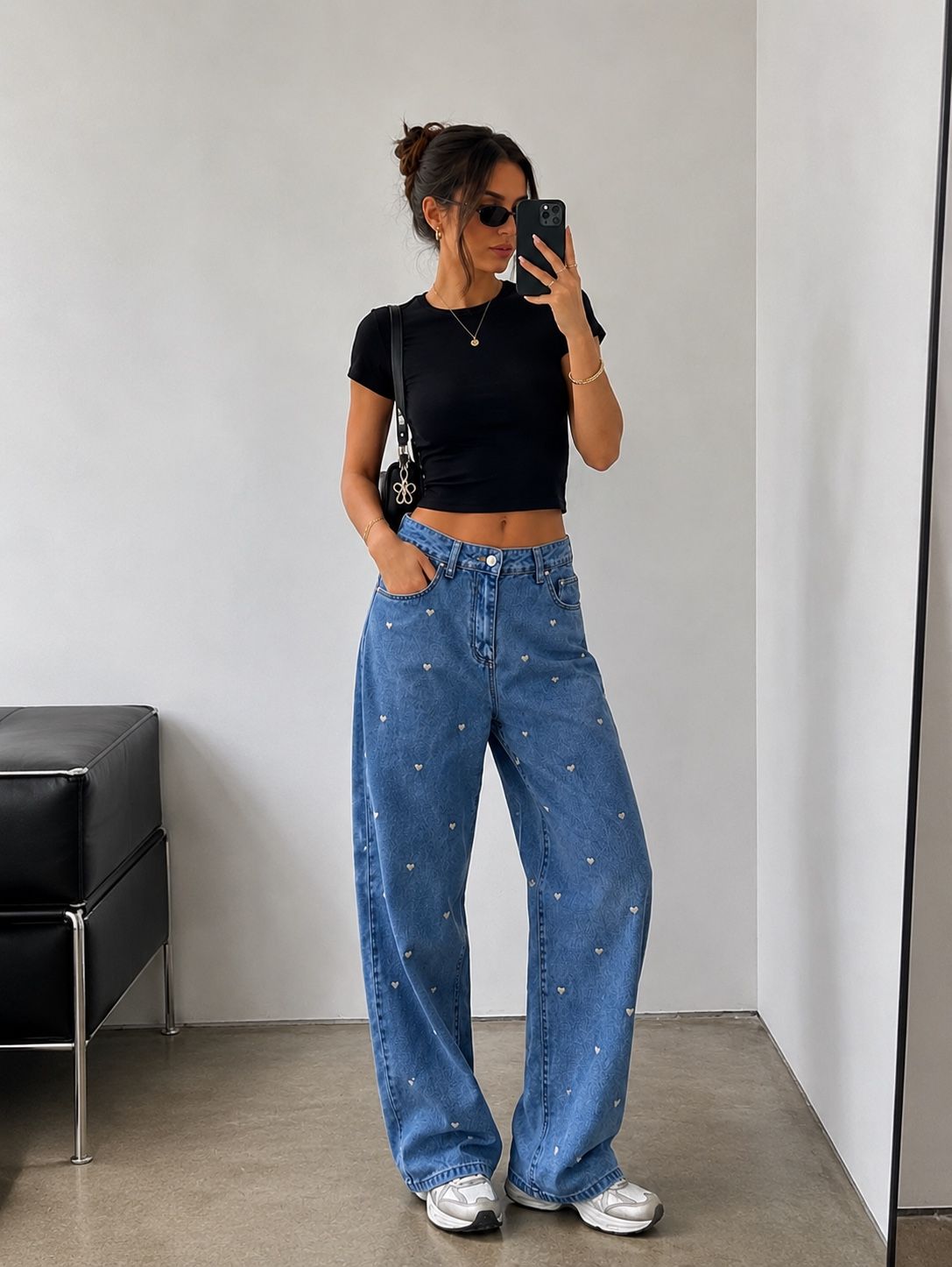 Wide high‑waist jeans with subtle print